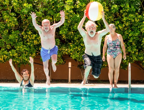 Older men having fun in the pool