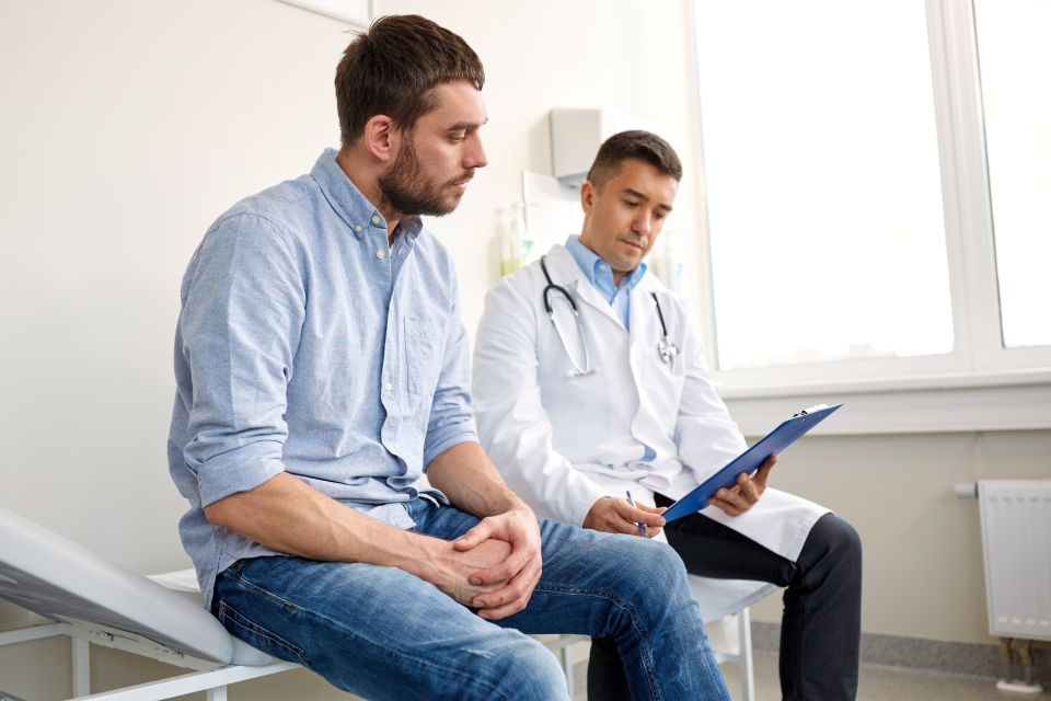 Man speaking with doctor